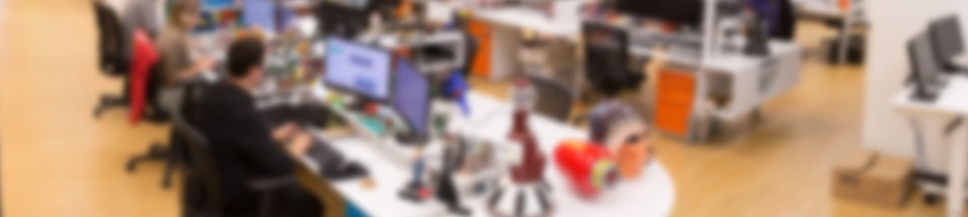 A blurred background image from inside the FUN.com offices